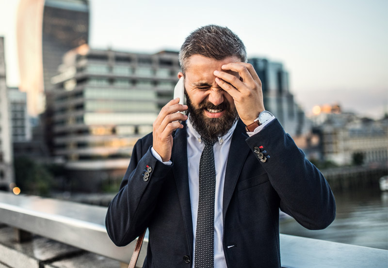 man frustrated on call